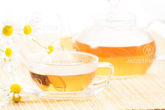 teacup with herbal chamomile tea