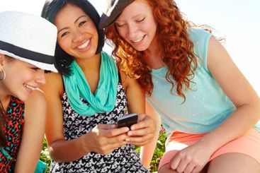 Phone, outdoor and portrait of girl friends with...