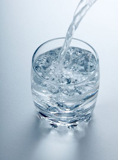 Water flowing into glass