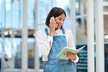 Phone call, notebook and businesswoman in office for...