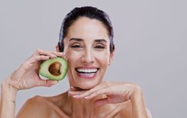 Happy, skincare and portrait of woman with avocado for...