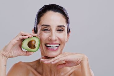 Happy, skincare and portrait of woman with avocado for...
