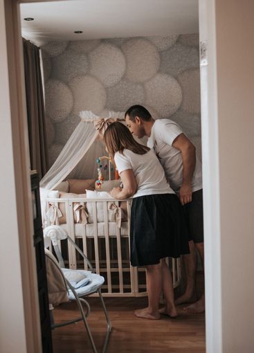 newborn baby in the arms of parents