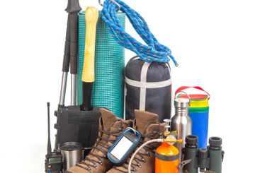 Items for tourism and hiking near a tourist backpack on...