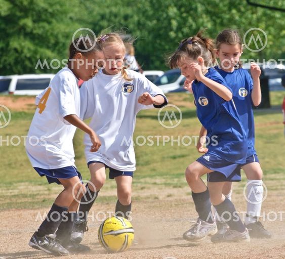 Going For the Ball Girl's Soccer