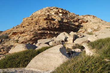 Coastal cliff at sunset.