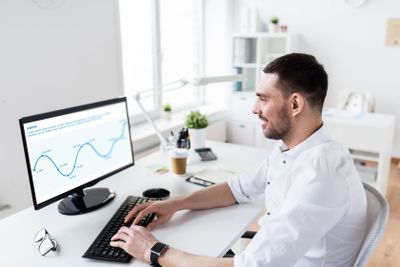 businessman typing on computer keyboard at office