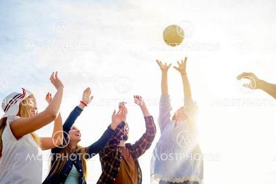 Friends playing volleyball