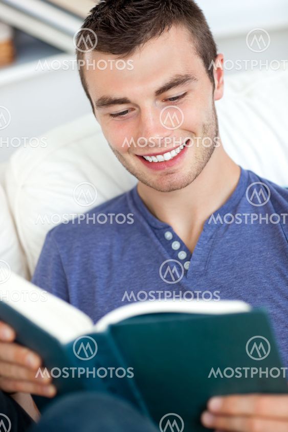 Young man reading a book