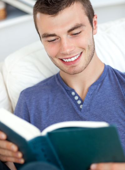 Young man reading a book