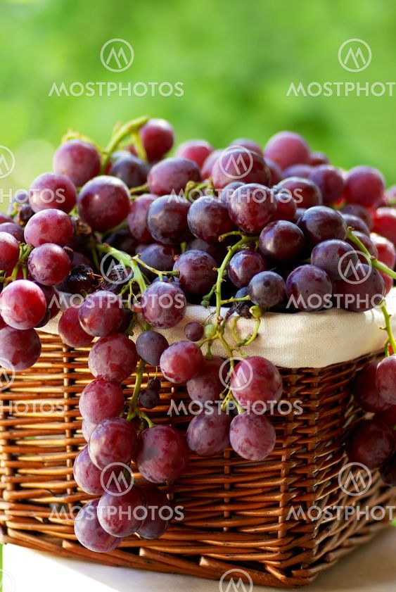red grapes in a basket.