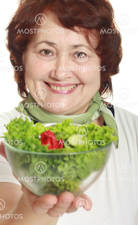 Mature woman with fresh salad