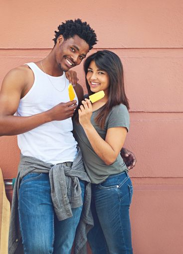 Portrait, skateboard and couple with ice cream in city...