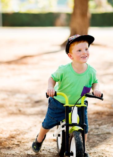 Outdoor, child and happy with bicycle for ride, learning...