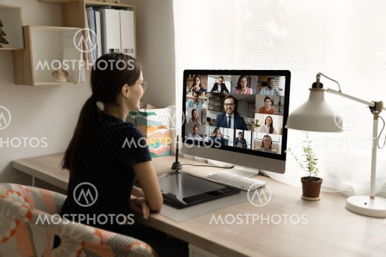 Happy millennial female employee holding video call...