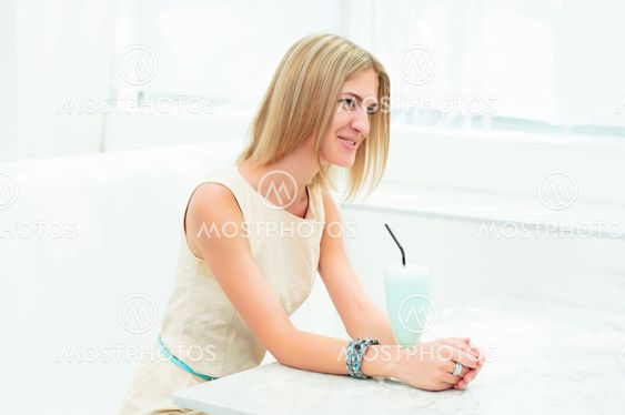 portrait of a beautiful woman in the cafe