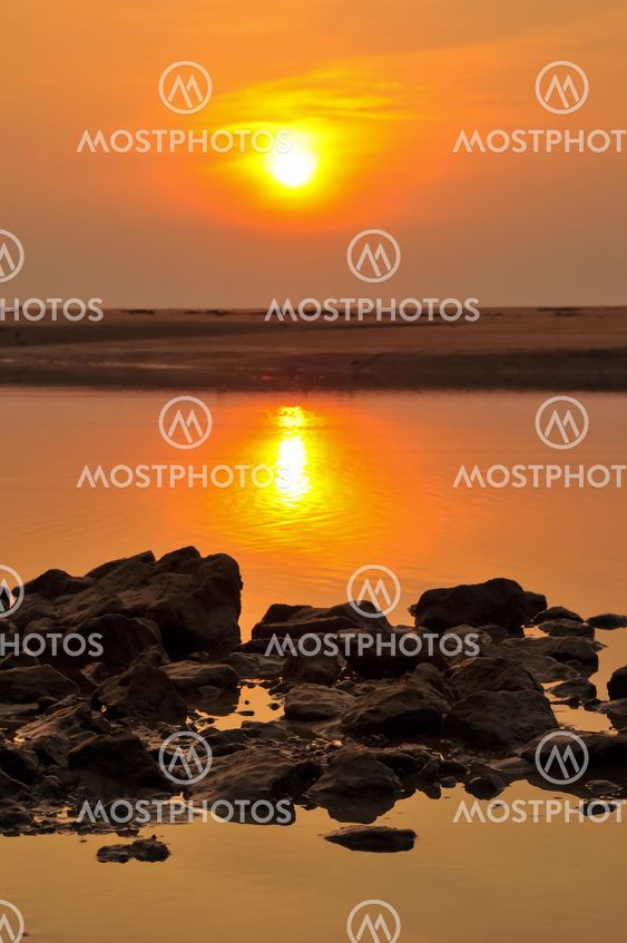 Sea stones and sunset