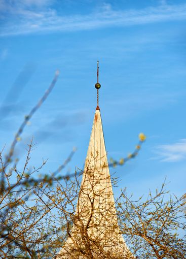 Ancient, steeple and architecture of building with blue...