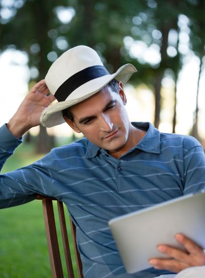 Man Looking at Tablet PC Screen