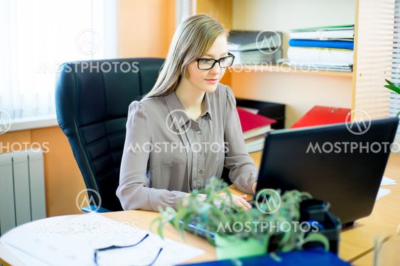 worker sitting in front of laptop