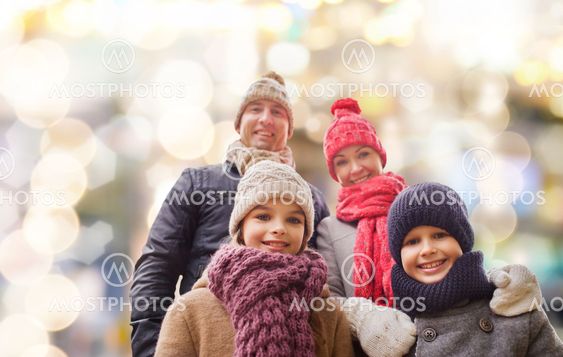 happy family in winter clothes outdoors