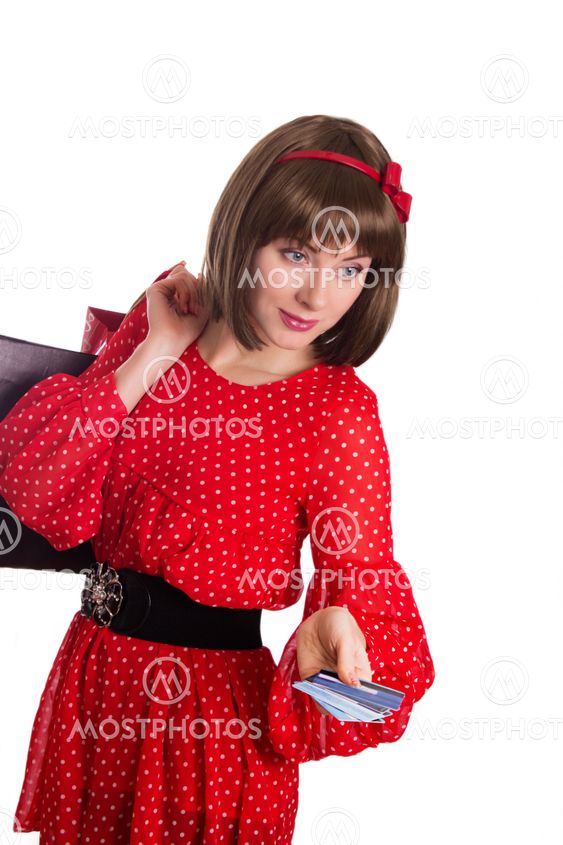 Woman with a credit card and shopping bags
