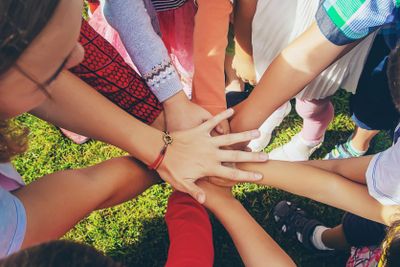 children folded their hands together, play on the...