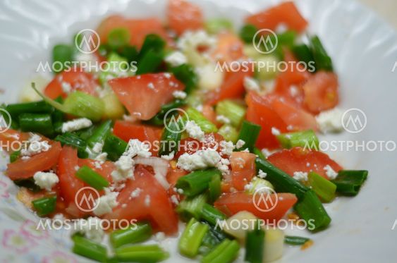 Salad with tomatoes, cheese and onions