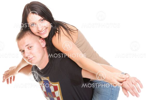Portrait of a beautiful young happy smiling couple isolated