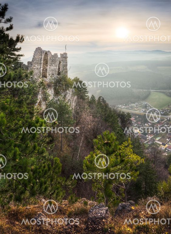 Ruins of a Castle with Mountains and Village in Background