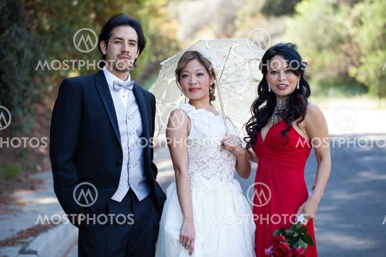 Beautiful smiling Bride, Groom with brides maid