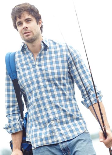 Man, fisher and walking with rod in nature with backpack...