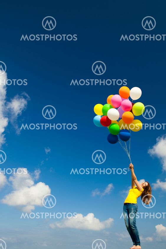 Girl with colorful balloons