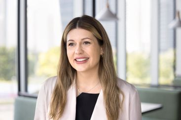 Young Caucasian woman looking into distance with...