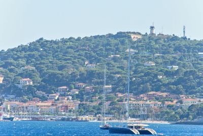 Daylight view to sailing yacht and boats cruising on water