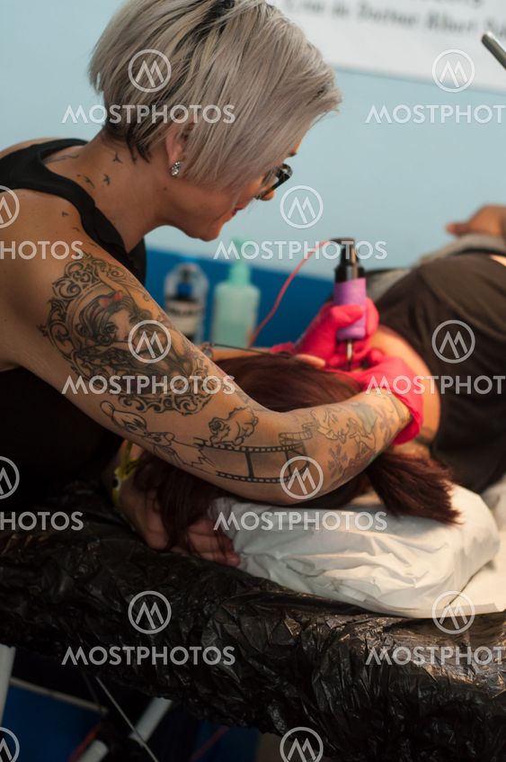 tattooing exhibition at fun car show event