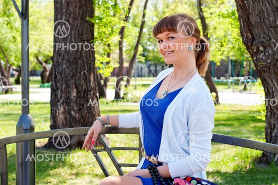 portrait of a beautiful woman in summer park