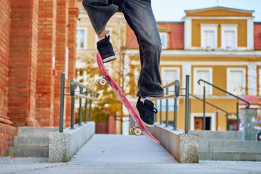 Skateboarder Performing Trick on Urban Street