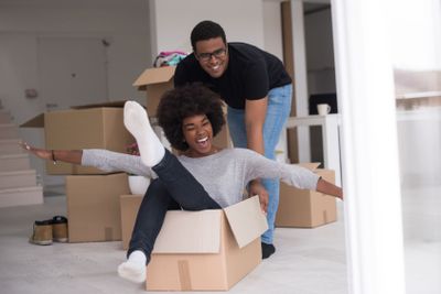 African American couple  playing with packing material
