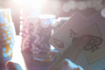 Poker game set of cards and chips close up