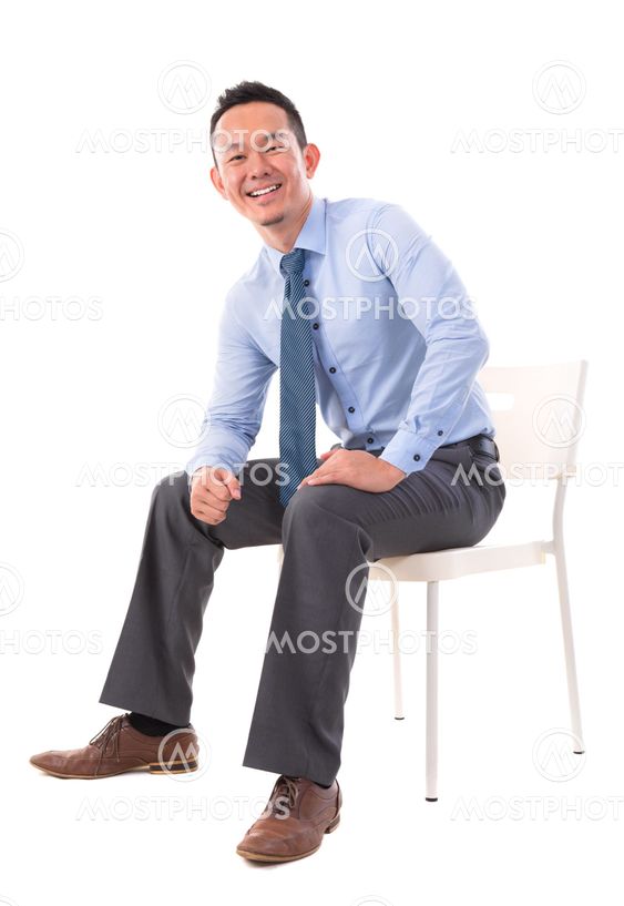 Full body Asian business man sitting