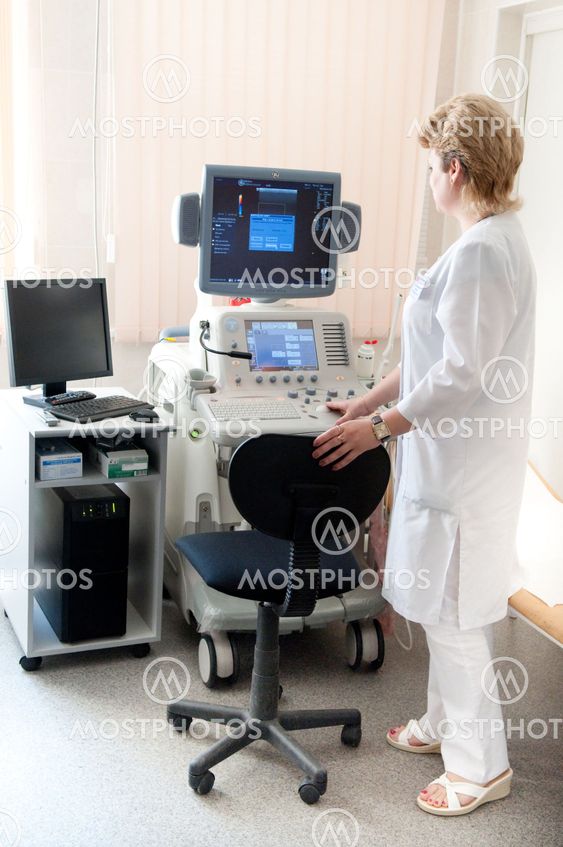 medical doctor during ultrasound investigation