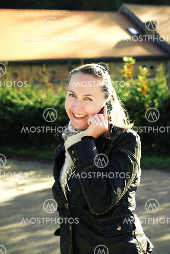 A young woman talking on the phone