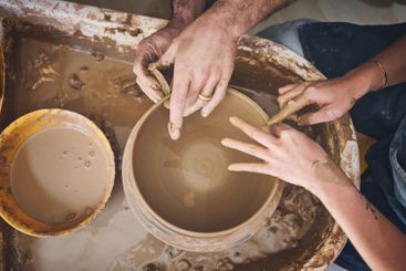 People, hands and molding pottery in studio, working...