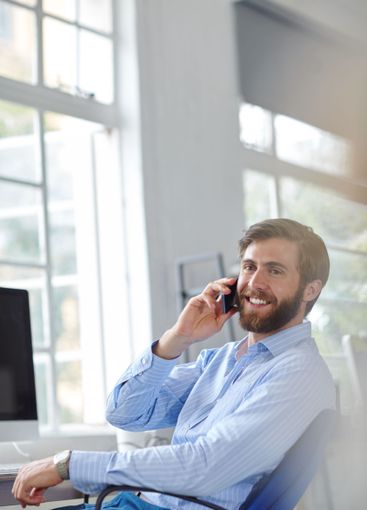 Man, architect and phone call in office, professional...