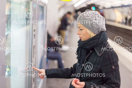 Lady buying ticket for public transport.