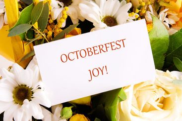 OCTOBERFEST JOY concept words on a white card in a...