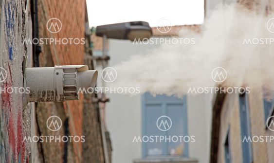 cloud of vapor escaping from an outside pipe
