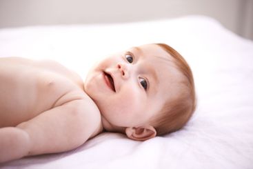 Happy, girl and baby on bed with thinking for childhood...