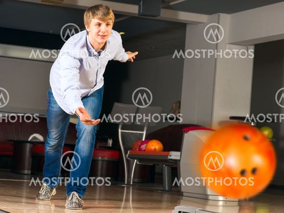 young man playing bowling